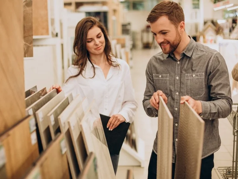 young couple looking at flooring samples