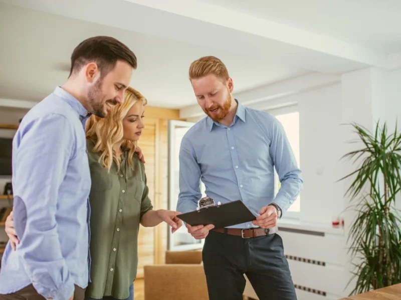 young couple getting a in-home flooring estimate